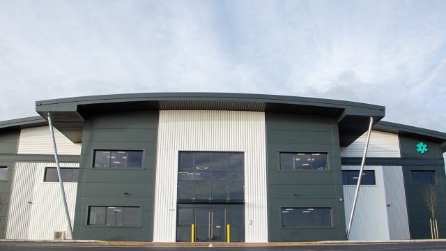 Dove Valley Park plot 10a. Grey and white front of warehouse unit.