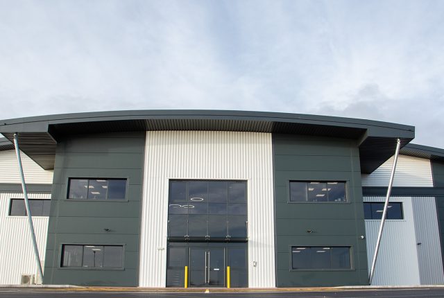 Dove Valley Park plot 10a. Grey and white front of warehouse unit.