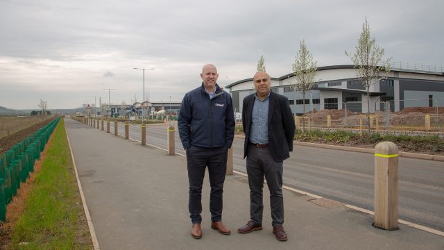Fairham Business Park Two men stood on pavement outside an industrial unit