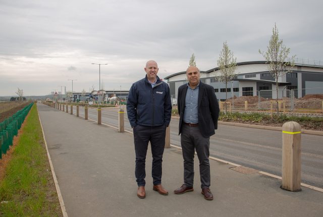 Fairham Business Park Two men stood on pavement outside an industrial unit
