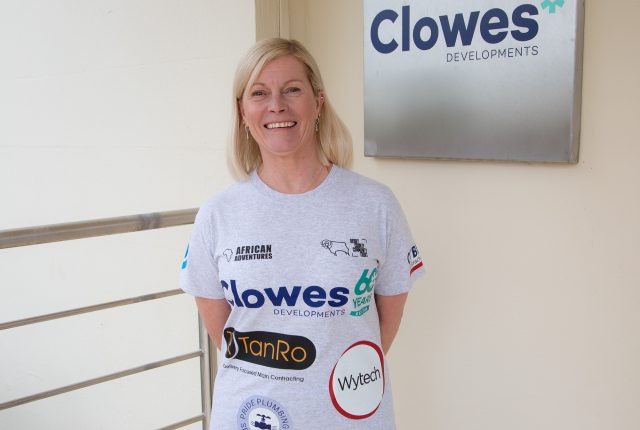 Clowes Developments Amanda Page Rams in kenya woman wearing grey tshirt with logos on