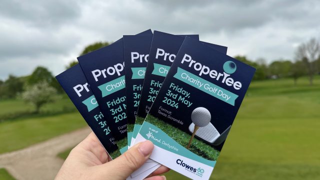 Clowes Developments ProperTee golf day Golf score cards fanned with course in background