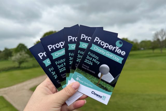Clowes Developments ProperTee golf day Golf score cards fanned with course in background