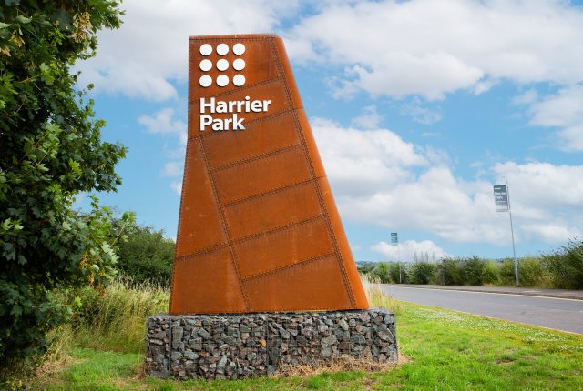 Clowes Developments Harrier Park Sign within greenery
