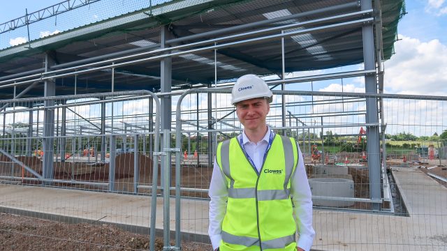 Clowes Developments man wearing hi-vis and hard hardon construction site