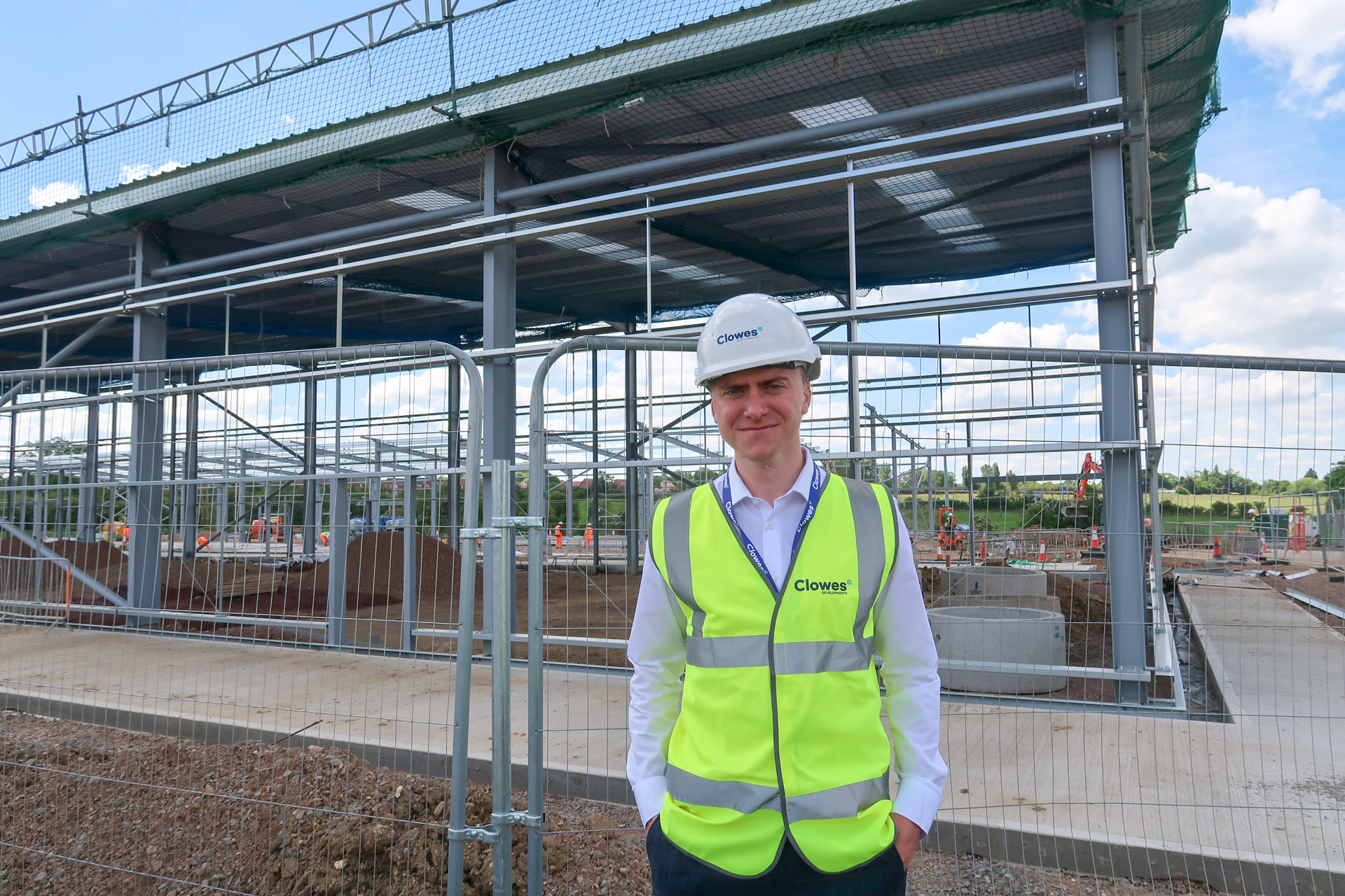 Clowes Developments man wearing hi-vis and hard hardon construction site