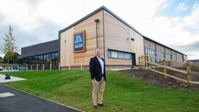 Clowes Developments Viking Park man stood in-front of supermarket