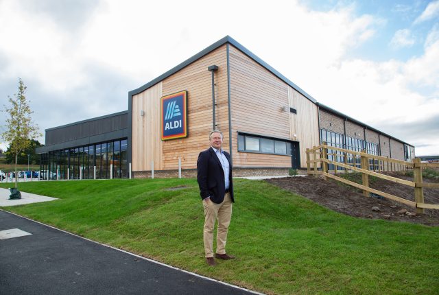 Clowes Developments Viking Park man stood in-front of supermarket