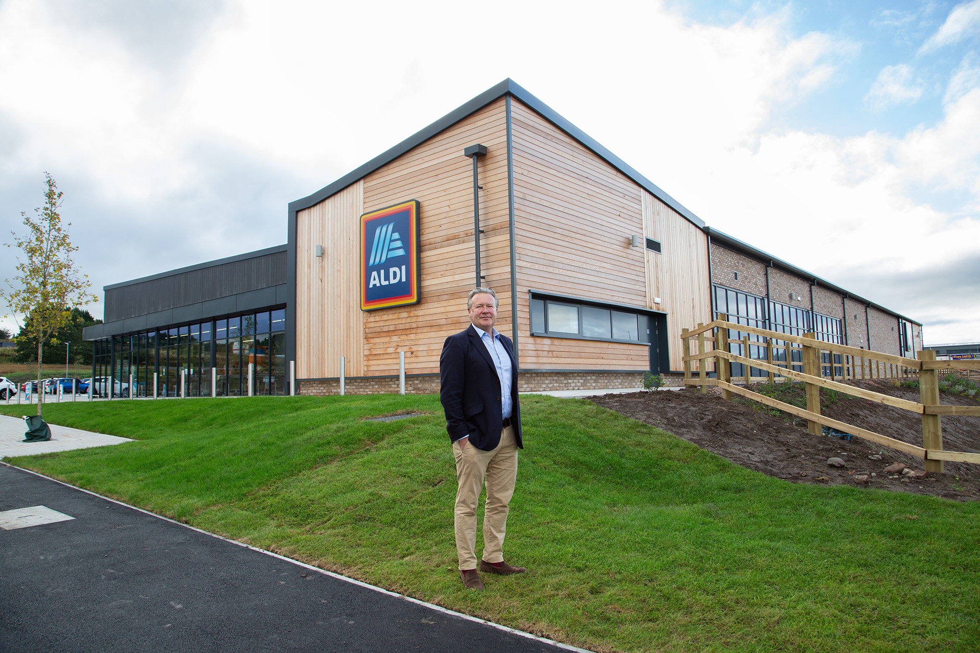 Clowes Developments Viking Park man stood in-front of supermarket